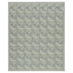 Rug & Kilim's Teppich im skandinavischen Stil mit geometrischem Muster in Blau, Weiß und Creme