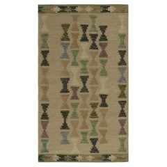 Rug & Kilim’s Scandinavian Style Rug with Polychromatic Hourglass Patterns