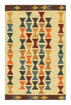 Rug & Kilim’s Scandinavian Style Rug with Polychromatic Hourglass Patterns