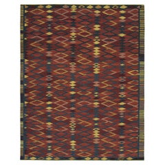 Rug & Kilim's Teppich im skandinavischen Stil mit roten und blauen geometrischen Mustern
