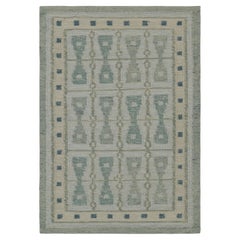 Rug & Kilim's Scandinavian Style Square Rug in Blue, with Hourglass Patterns (tapis carré de style scandinave avec des motifs en sablier)