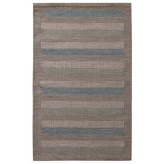 Rug
Kilim è un kilim in lana a righe beige-marrone, verde e blu in stile scandinavo.