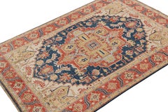 Rug & Kilim’s Serapi style rug in Navy Blue with Gold and Red Medallion