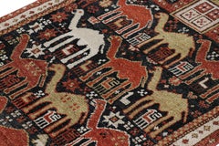 Rug & Kilim’s Shirvan Style Rug in Black with Colorful Camel Pictorials