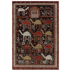 Rug & Kilim’s Shirvan Style Rug in Black with Colorful Camel Pictorials