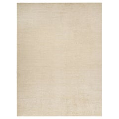 Rug & Kilim è un tappeto solido beige-marrone in stile contemporaneo tono su tono.