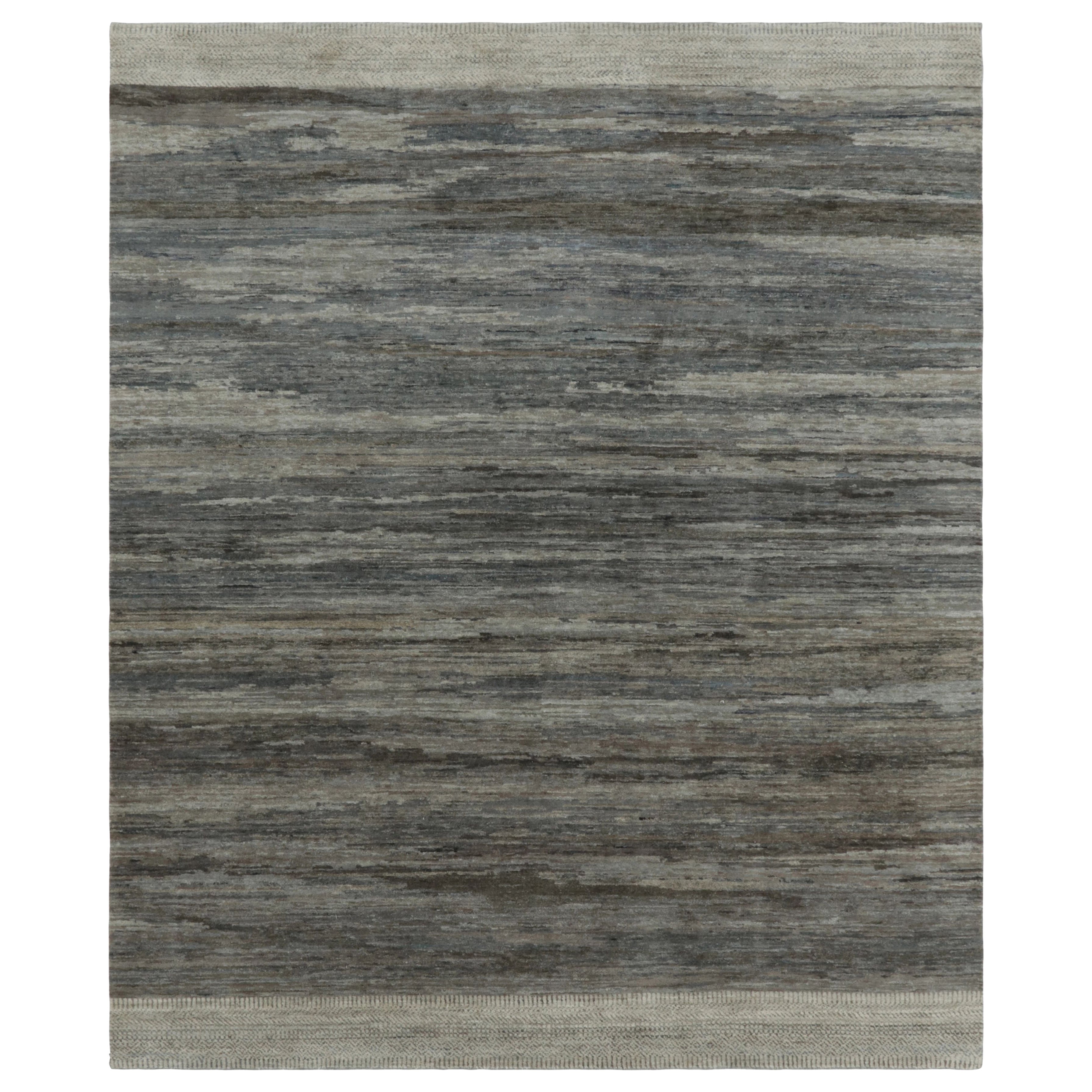 Rug 
Kilim è un tappeto a struttura solida, con strisce e striature monocromatiche blu e grigie.