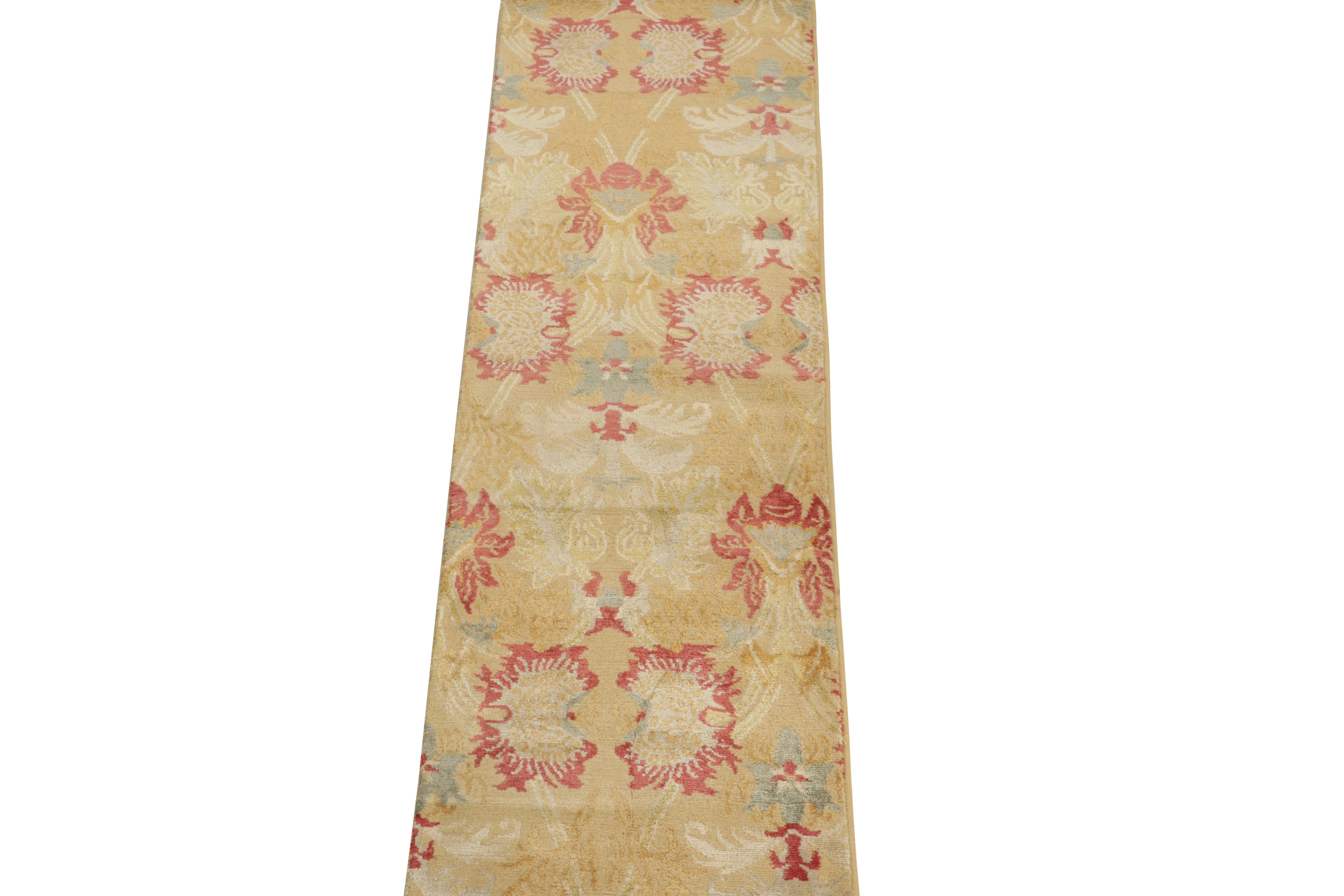 Hand-knotted in luxurious silk, a 2x6 contemporary runner from our European collection. The drawing carries our Toledo design inspired by Spanish antique floral rugs in an alluring play of gold, red & blue for a lustrous appeal. One of our most