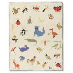 Rug & Kilim’s Suzani-Inspired Kilim, Playful Animal Pictorials over Cream White