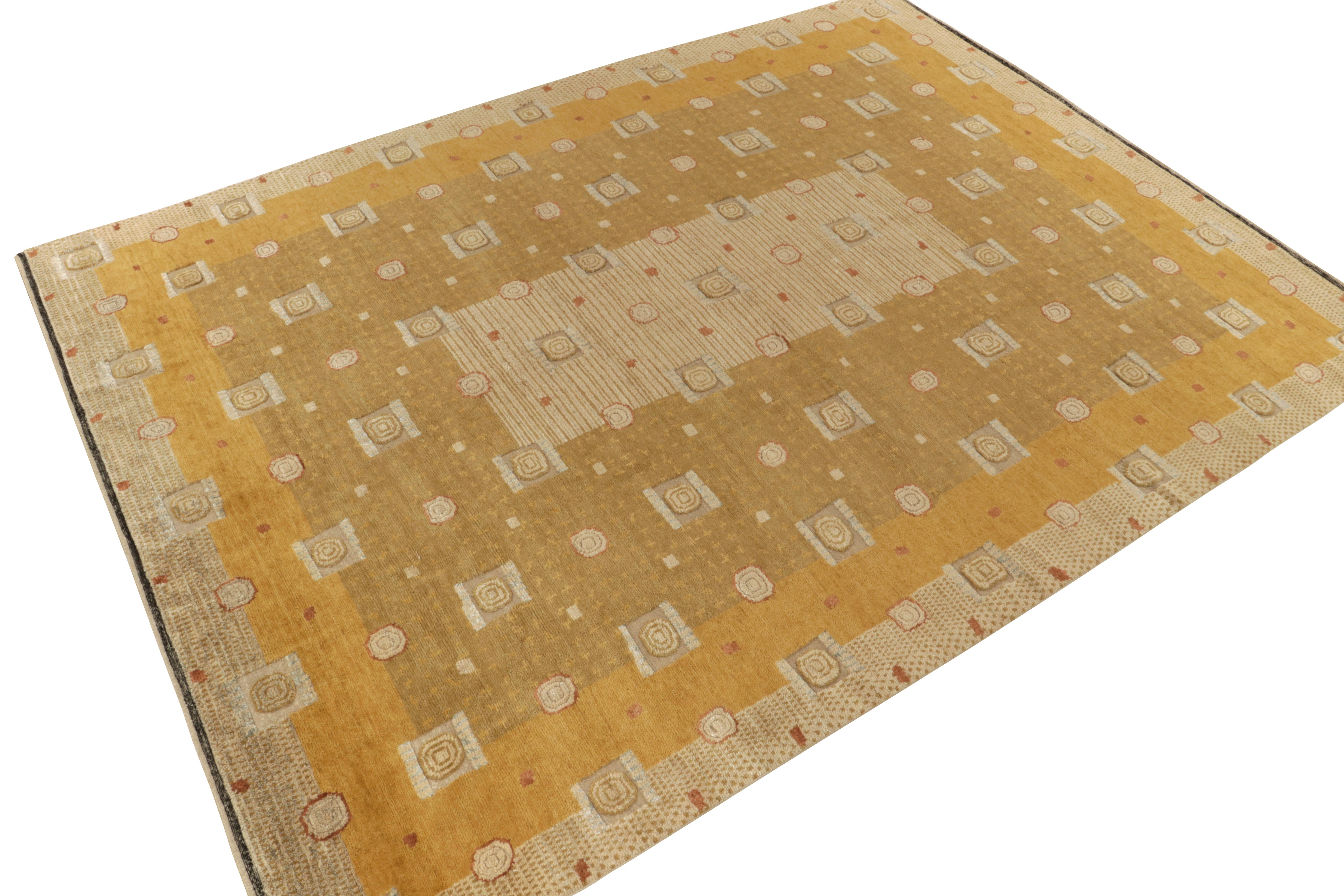 A 10x14 ode to celebrated Art Deco rug styles, from Rug & Kilim’s Deco Collection. Hand knotted in wool, marrying dynamic high-low pile textures with geometric patterns in gold and beige-brown hues. Crisp white accents bring out the graphic,