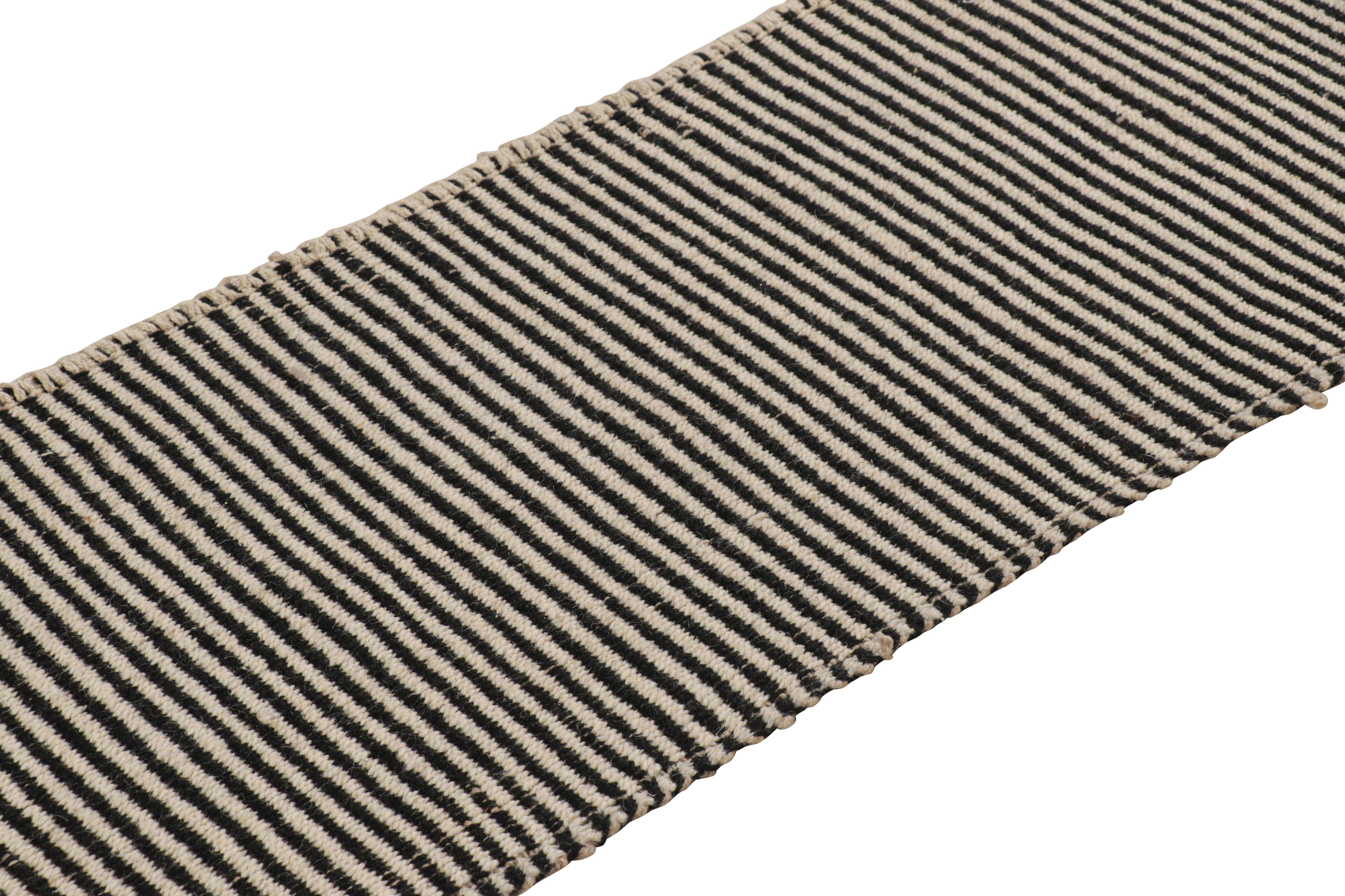 A 2x6 runner Kilim design from our more durable modern flat weave selections, handwoven in wool and originating from Turkey, features black and white accents in the warp and weft.

On the Design: 

Fondly dubbed, “Rez Kilim”, this modern take on