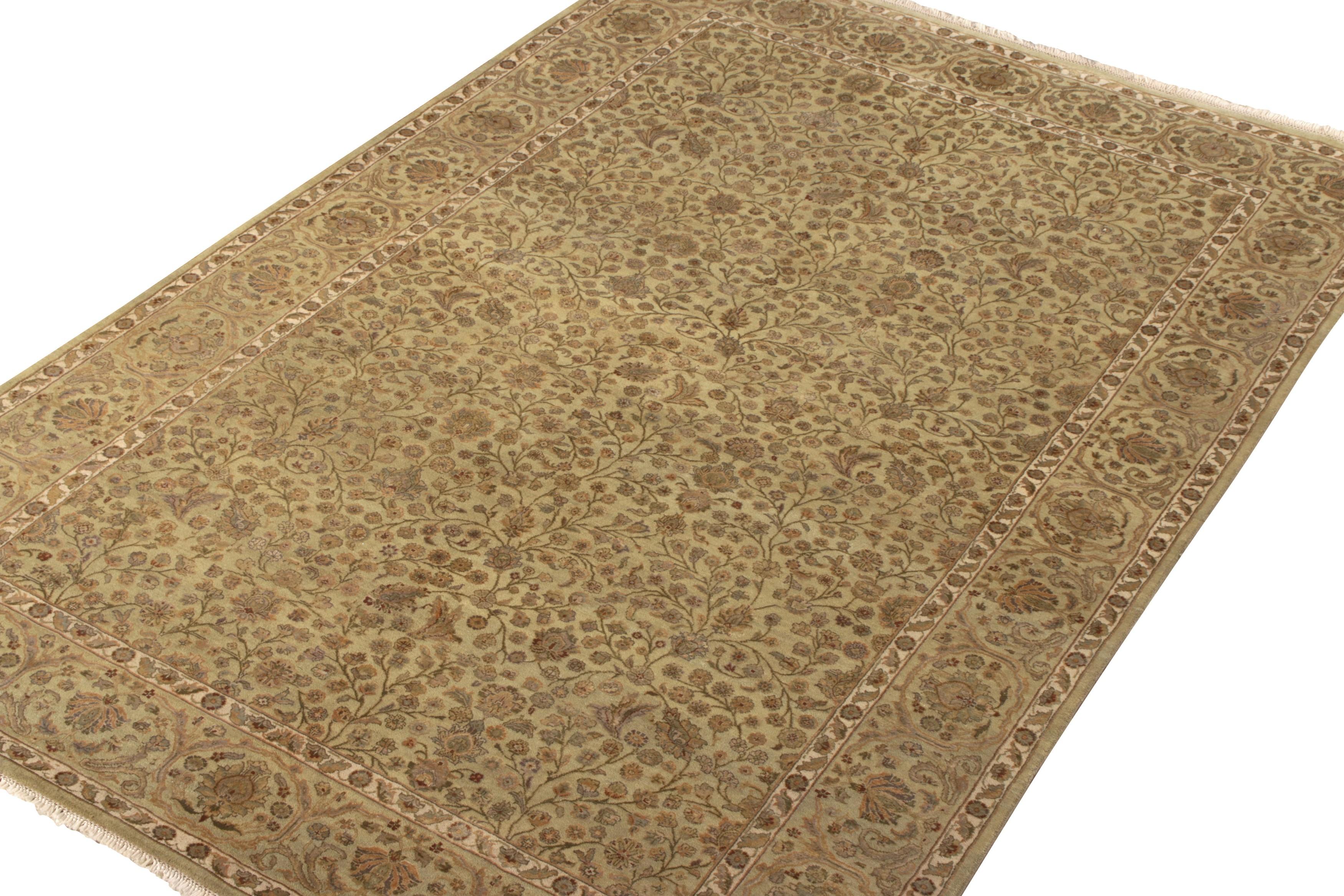 Hand knotted in wool and silk, a scintillating ode to Tabriz rugs combining traditional and modern aesthetics making way to Rug & Kilim’s Modern Classics Collection. Of 6x9 size, the rug relishes a delicious beige-brown and subtle green colorway as