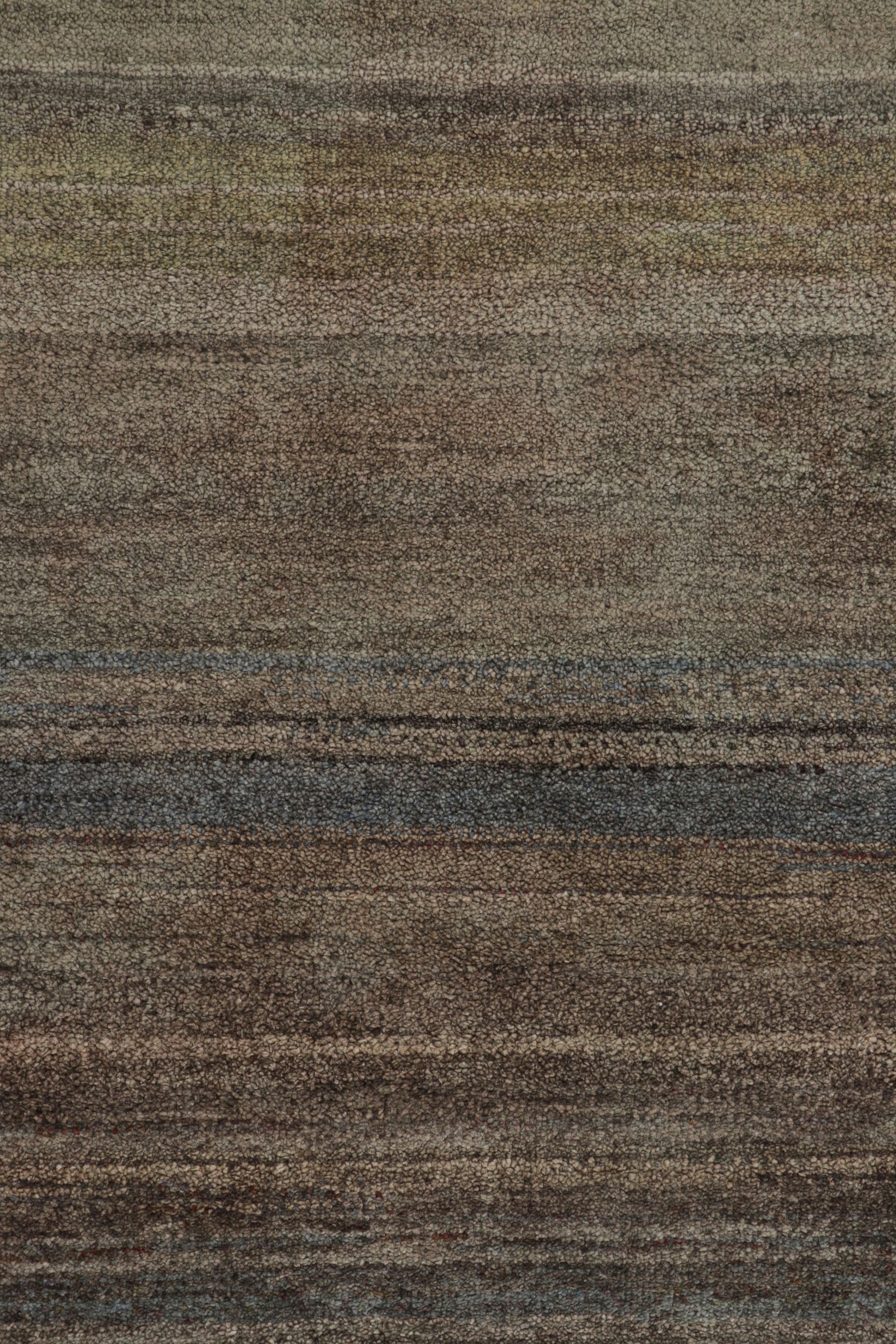 Hand-knotted in wool and silk, this 14x18 rug is a rich new addition to Rug & Kilim’s Textural rug collection—with an impressive range of colors and attention to movement in its unique play on stripes, striae, and subtle geometric patterns.

On the