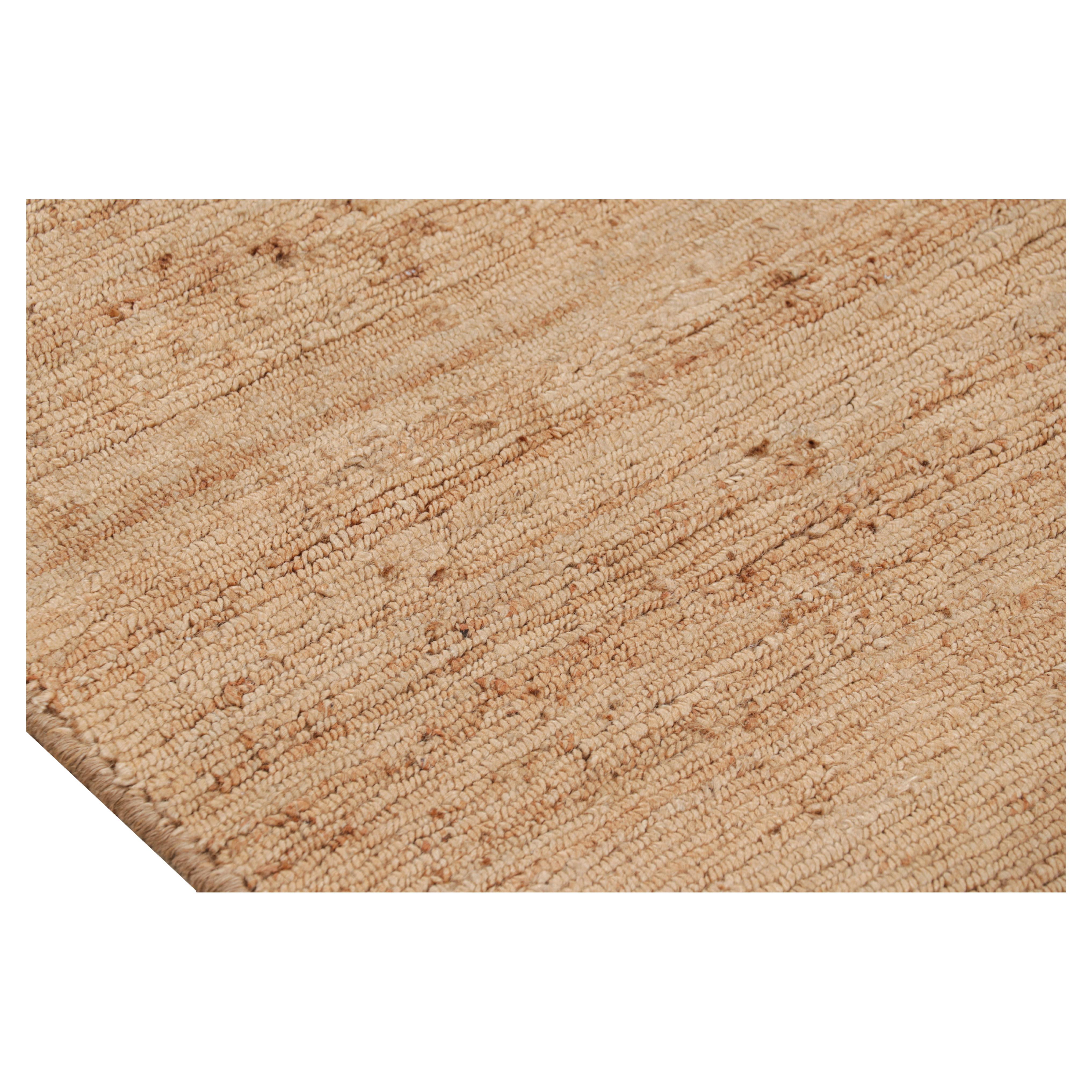 Dieser 8x11 große Strukturteppich von Rug & Kilim ist eine aufregende Neuheit in der Texture of Color-Kollektion. Er ist aus handgeknüpfter Jute gefertigt und zeigt beige-braune und kupferfarbene Streifen und Schlieren neben anderen neutralen