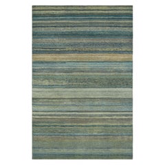 Rug 
Kilim è un tappeto testurizzato con strisce e striature nei toni del verde acqua e dell
azzurro.