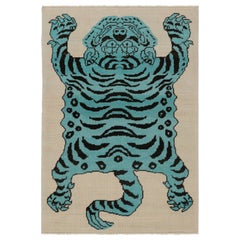 Rug & Kilim’s Tiger Skin Rug in Beige with Blue and Black Pictorial