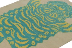 Rug & Kilim’s Tiger Skin Rug in Beige with Blue and Yellow Pictorial