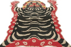 Rug & Kilim’s Tiger Skin Rug in Black with Beige, Gold and Red Pictorial