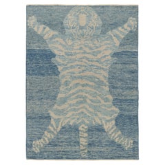 Rug & Kilim’s Tiger Skin Rug in Blue and Gray with Beige and Cream Pictorial