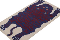 Rug & Kilim’s Tiger-Skin Rug in White with Blue & Red Pictorial
