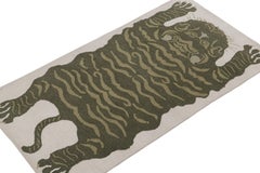 Rug & Kilim’s Tiger-Skin Rug in White with Pictorials in Tones of Green
