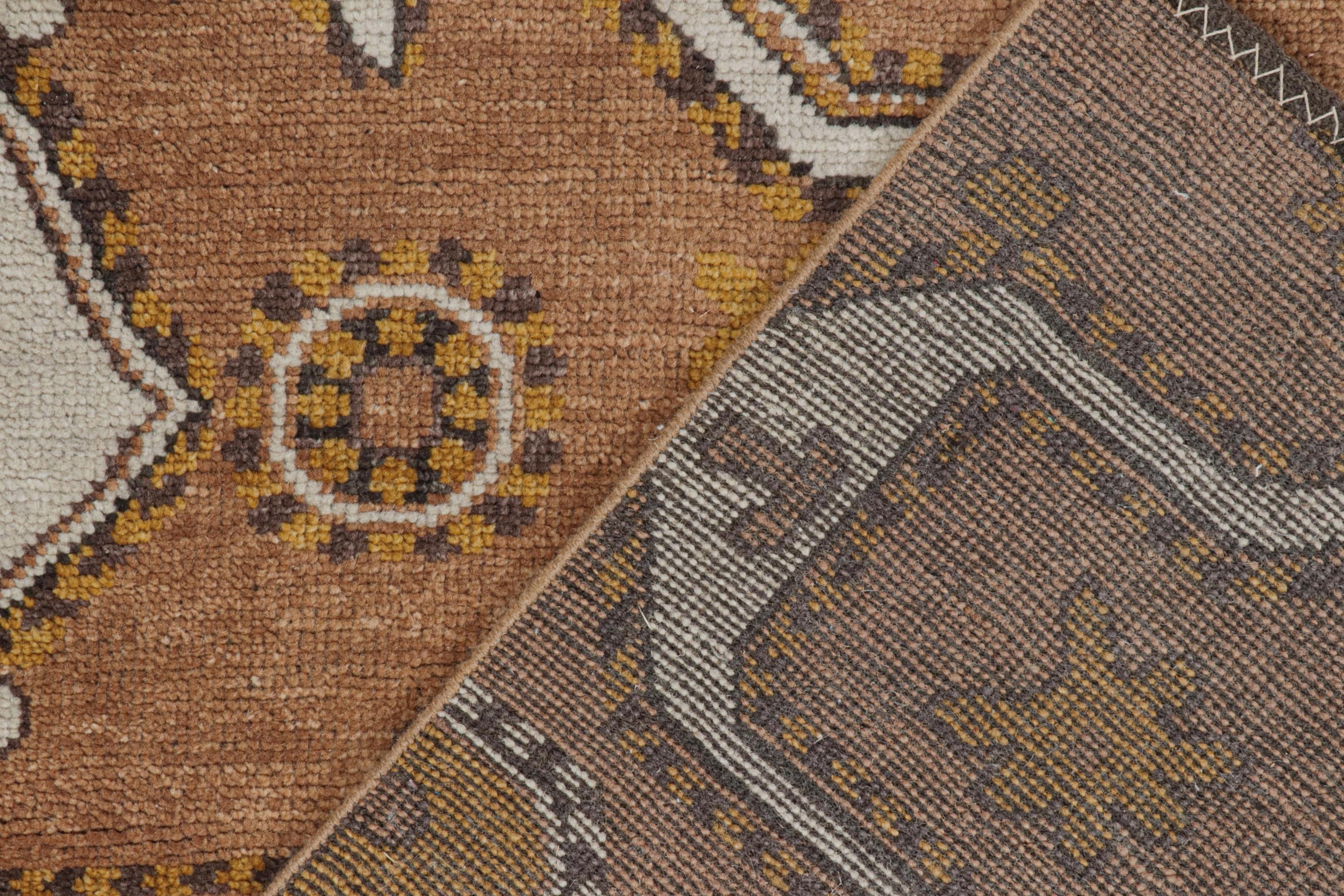 Wool Rug & Kilim’s Tribal inspired rug in Beige-Brown & Gold Geometric Patterns For Sale