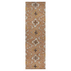 Rug & Kilim’s Tribal inspired rug in Beige-Brown & Gold Geometric Patterns