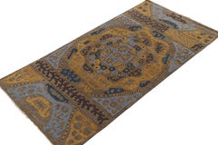Rug & Kilim’s Tribal Inspired Rug in Blue, Brown, Gold Geometric Patterns