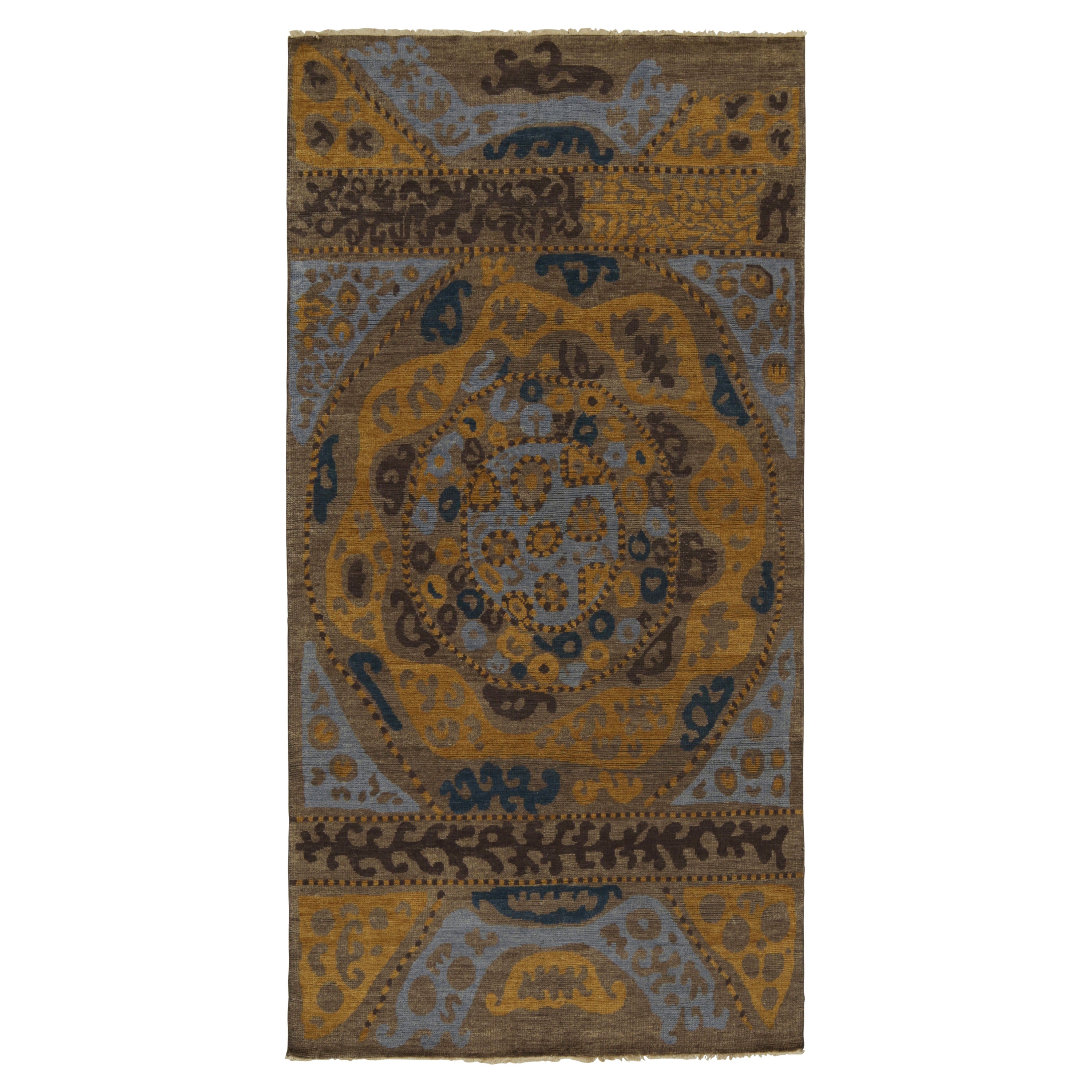 Rug & Kilim - Tappeto di ispirazione tribale con motivi geometrici blu, marrone e oro