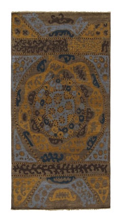 Rug & Kilim - Tappeto di ispirazione tribale con motivi geometrici blu, marrone e oro
