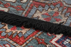 Rug & Kilim’s Tribal Rug in Blue and Red with Primitivist Geometric Patterns
