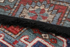 Rug & Kilim’s Tribal Rug in Blue and Red with Primitivist Geometric Patterns