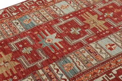 Rug & Kilim’s Tribal Rug in Rich Red, with Colorful Geometric Patterns