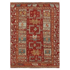 Rug & Kilim’s Tribal Rug in Rich Red, with Colorful Geometric Patterns