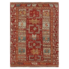Rug 
Kilims Stammesteppich in sattem Rot mit bunten geometrischen Mustern