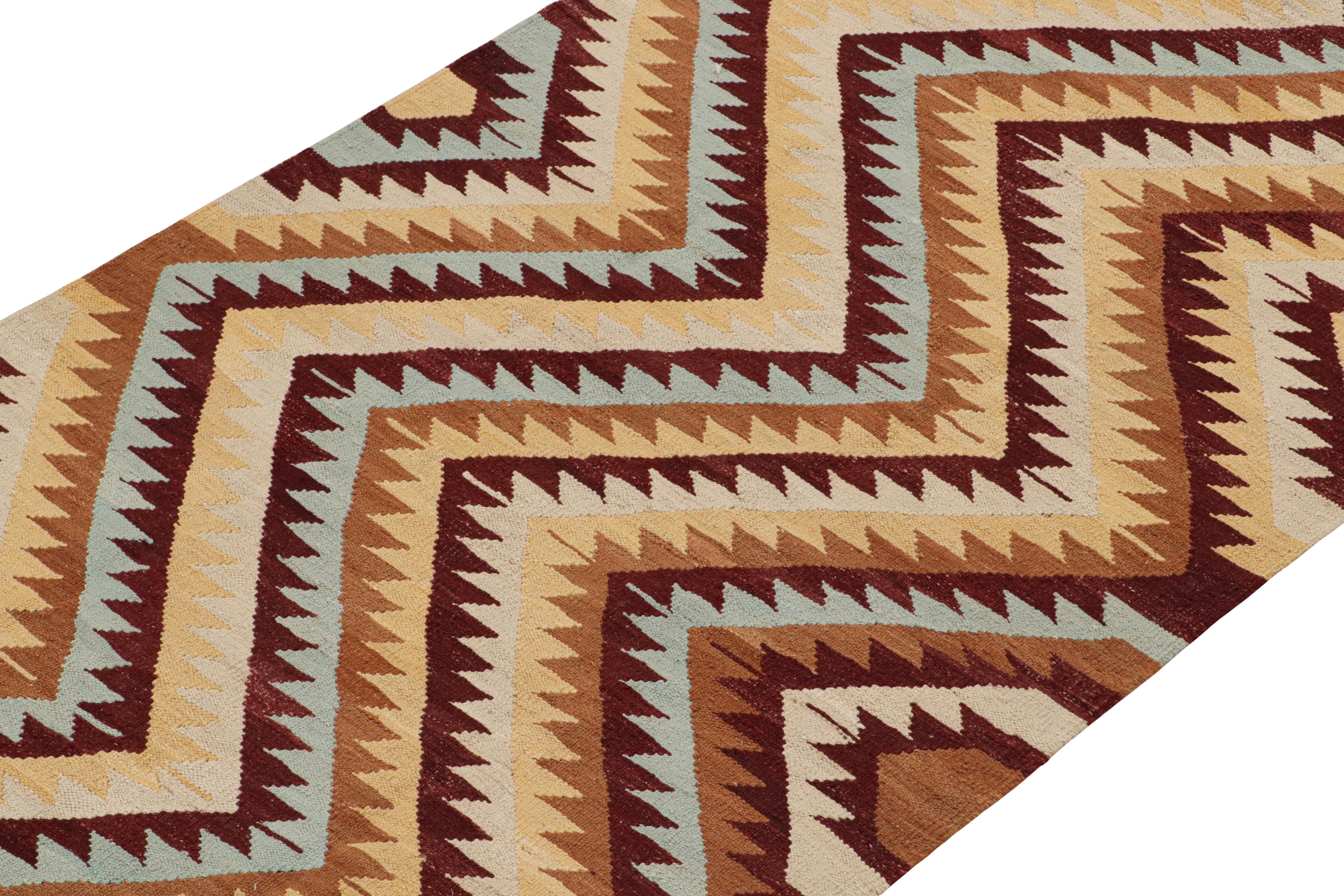 Handwoven in wool, this contemporary 4x12 Kilim by Rug & Kilim is inspired by antique tribal Kilims and flatweaves. 

On the Design:

This runner enjoys a play of chevrons and geometric patterns in burgundy, beige-brown, sky blue and gold hues.