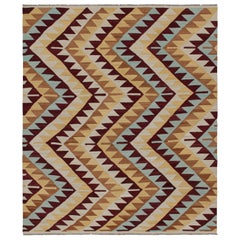 Kilim de style tribal de Rug & Kilim à motifs géométriques rouges, bleus et beige-brun