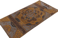 Rug & Kilim’s Tribal style rug in Beige-Brown, Gold and Blue Patterns