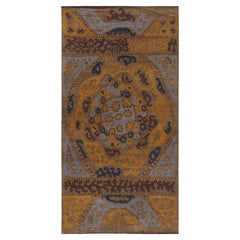 Rug & Kilim’s Tribal style rug in Beige-Brown, Gold and Blue Patterns