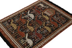 Rug & Kilim’s Tribal Style Rug in Black with Red, Gold-Brown Pictorial Patterns