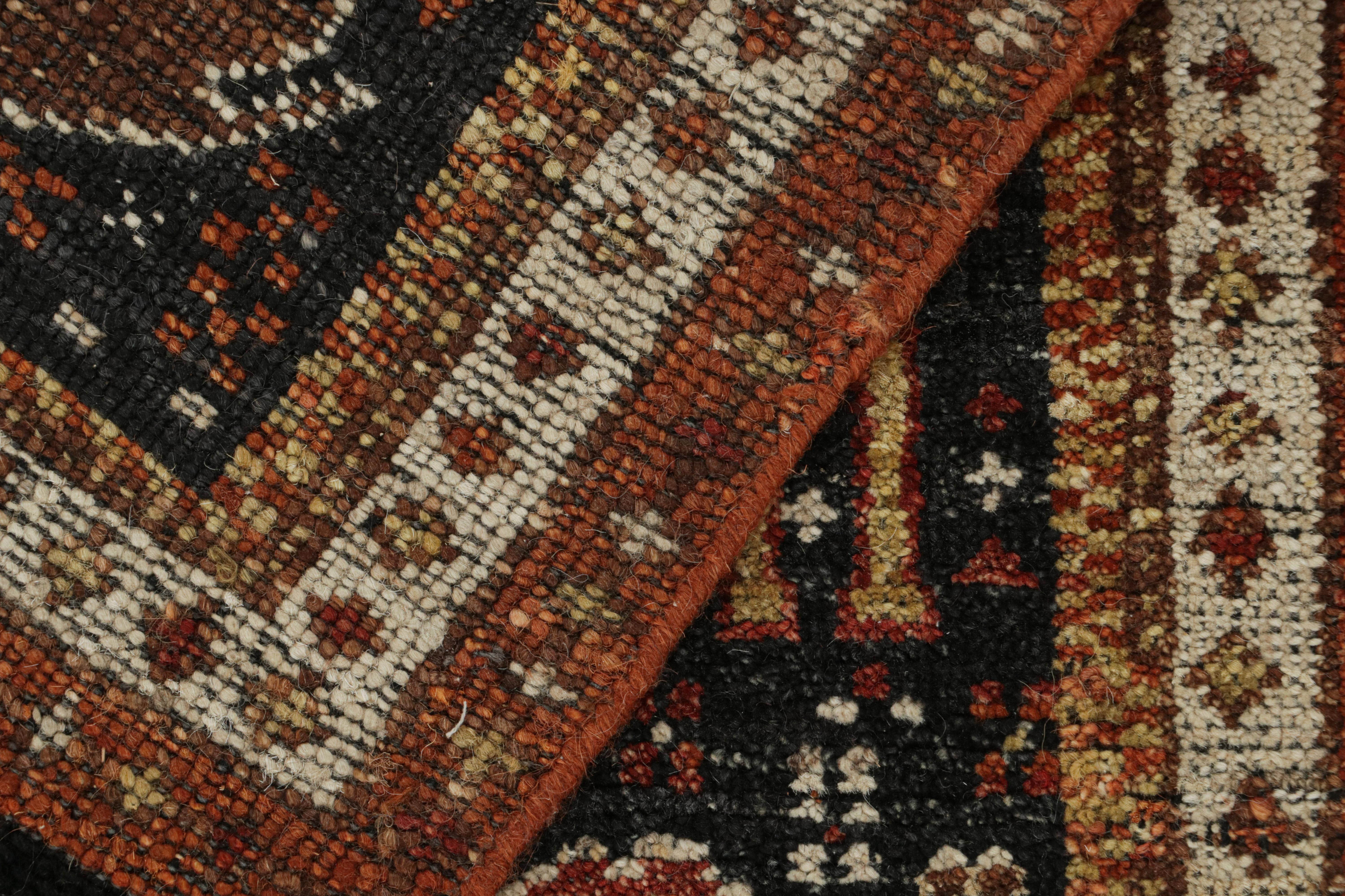 Laine Rug & Kilim’s Tribal style rug in Black with Red, Gold-Brown Pictorial patterns en vente