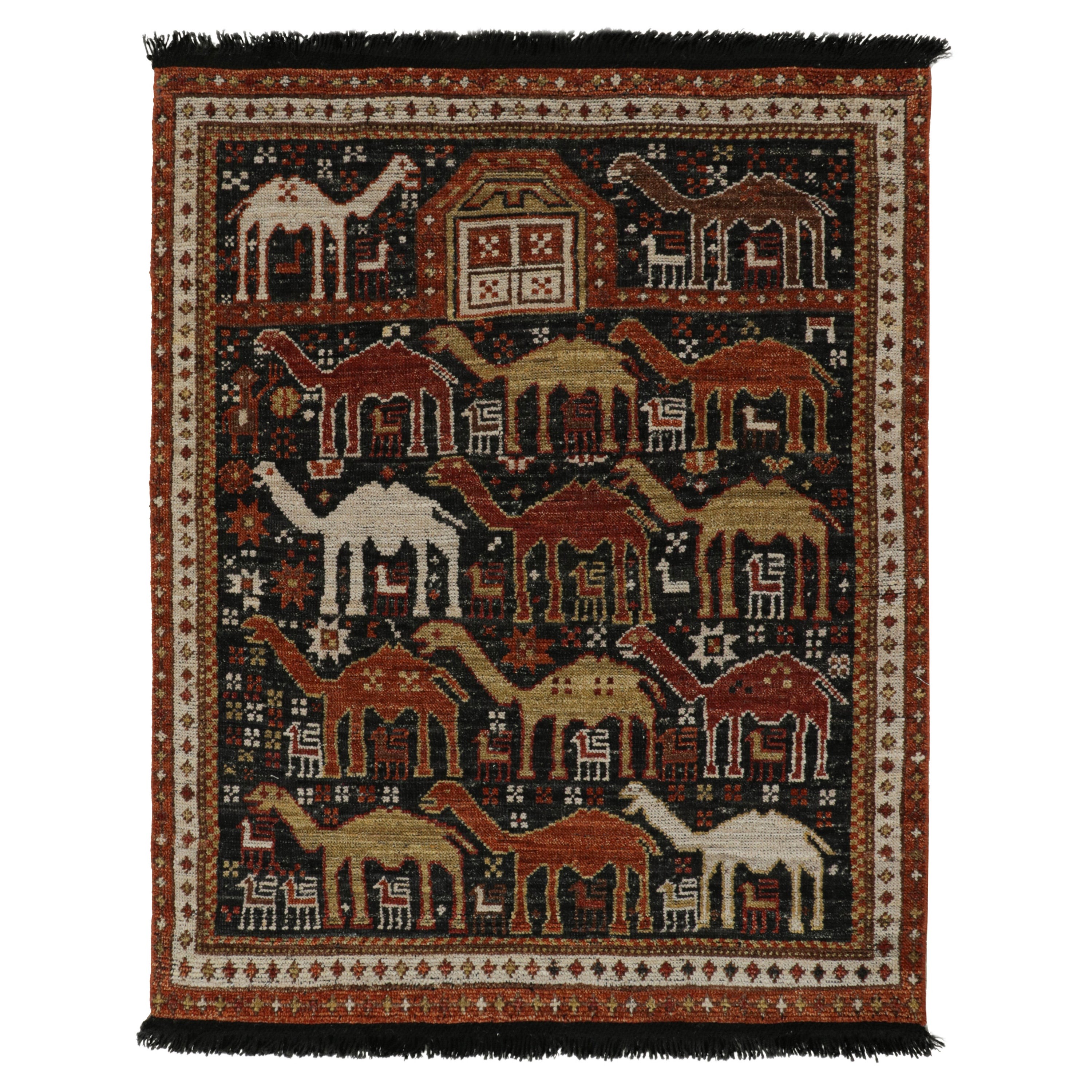 Rug & Kilim è un tappeto in stile tribale in nero con motivi pittorici rossi, oro e marrone.