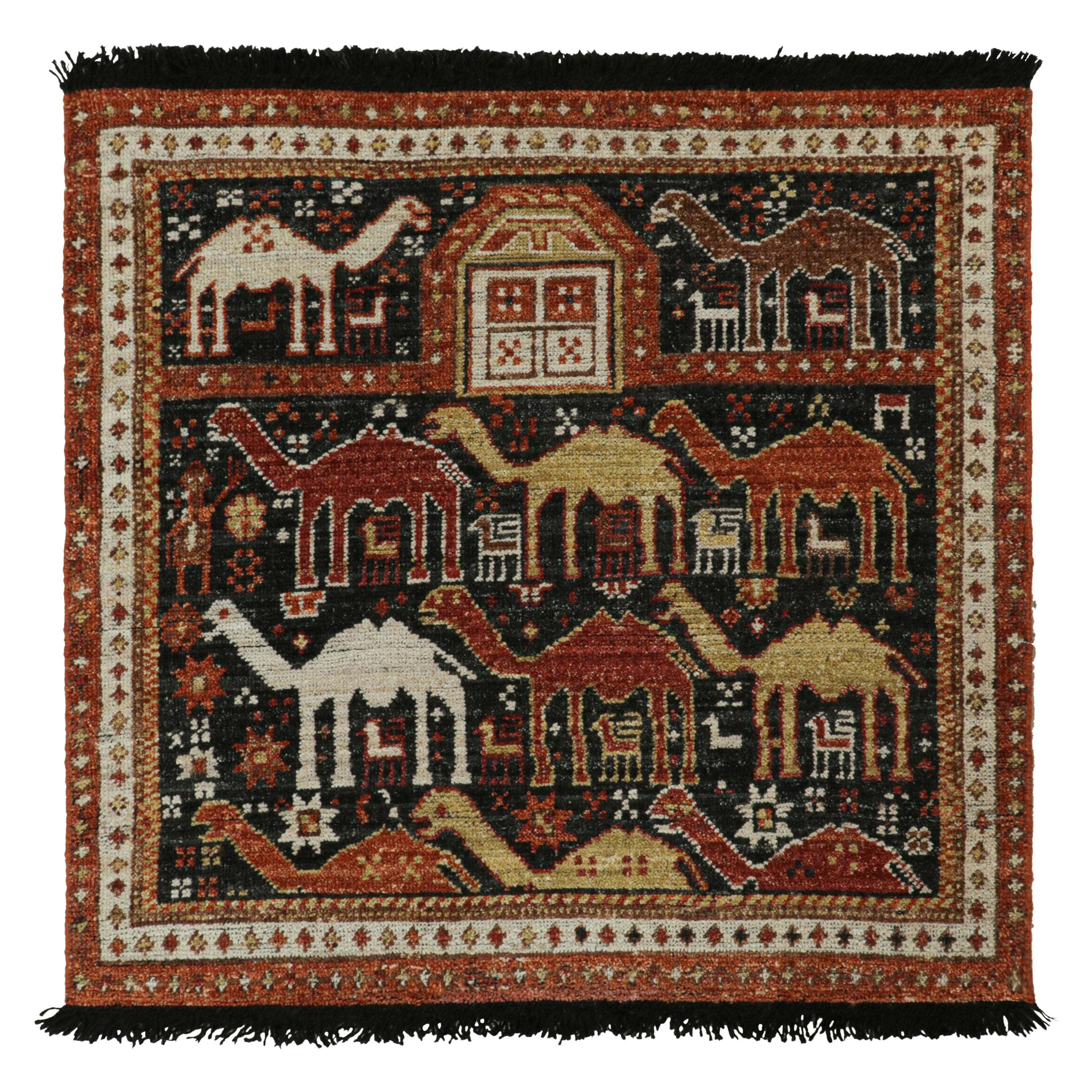 Rug & Kilim è un tappeto in stile tribale in nero con motivi pittorici rossi, oro e marrone.
