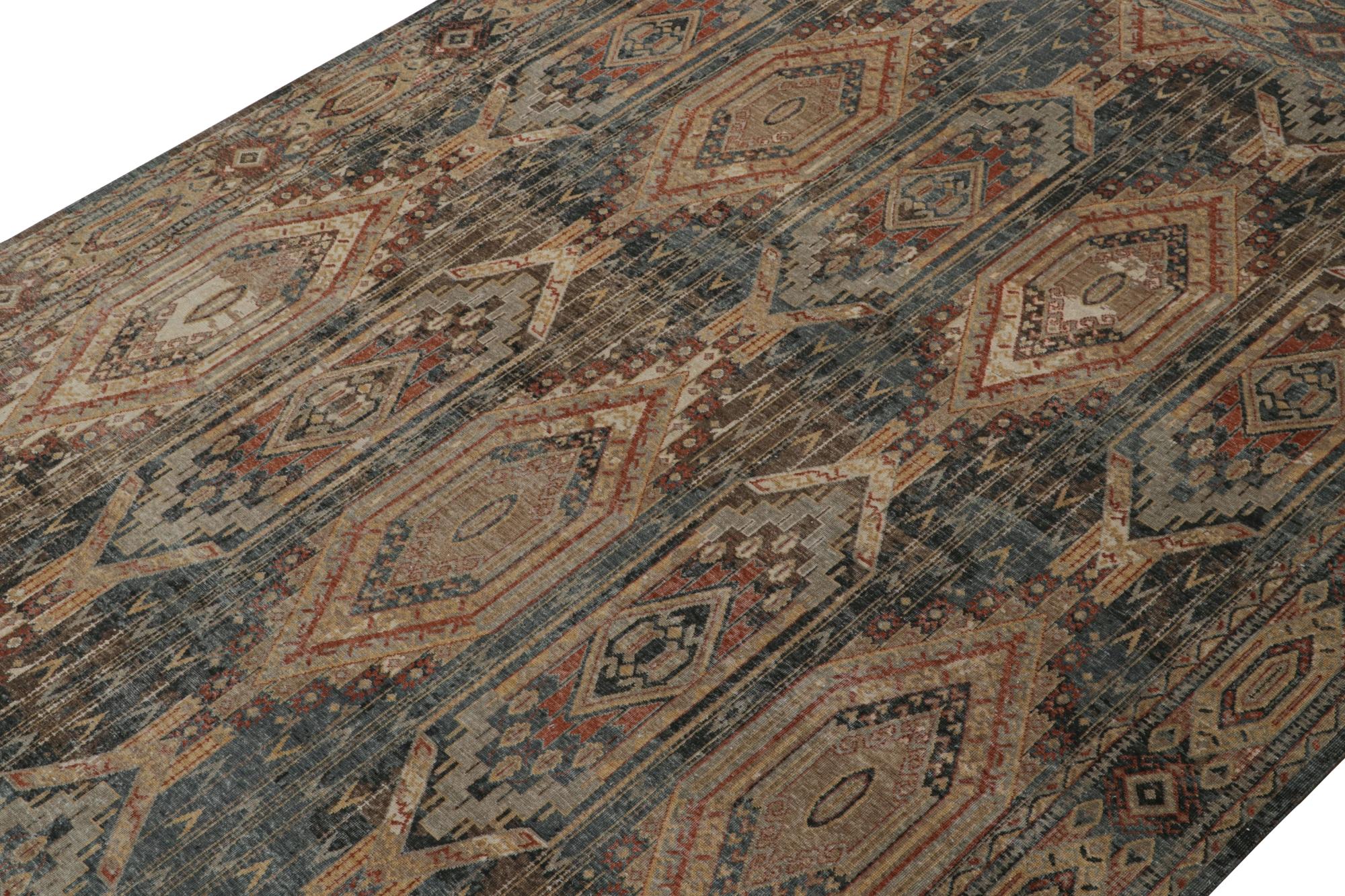 This 9x12 rug is a new addition to the Homage Collection by Rug & Kilim.

Further On the Design: 

Hand knotted in wool, this piece enjoys an elaborate geometric pattern in forgiving blue, brown, red & gold. Keen eyes will note that the
