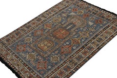 Rug & Kilim's Tribal Style Teppich in Blau, mit roten und goldenen geometrischen Mustern