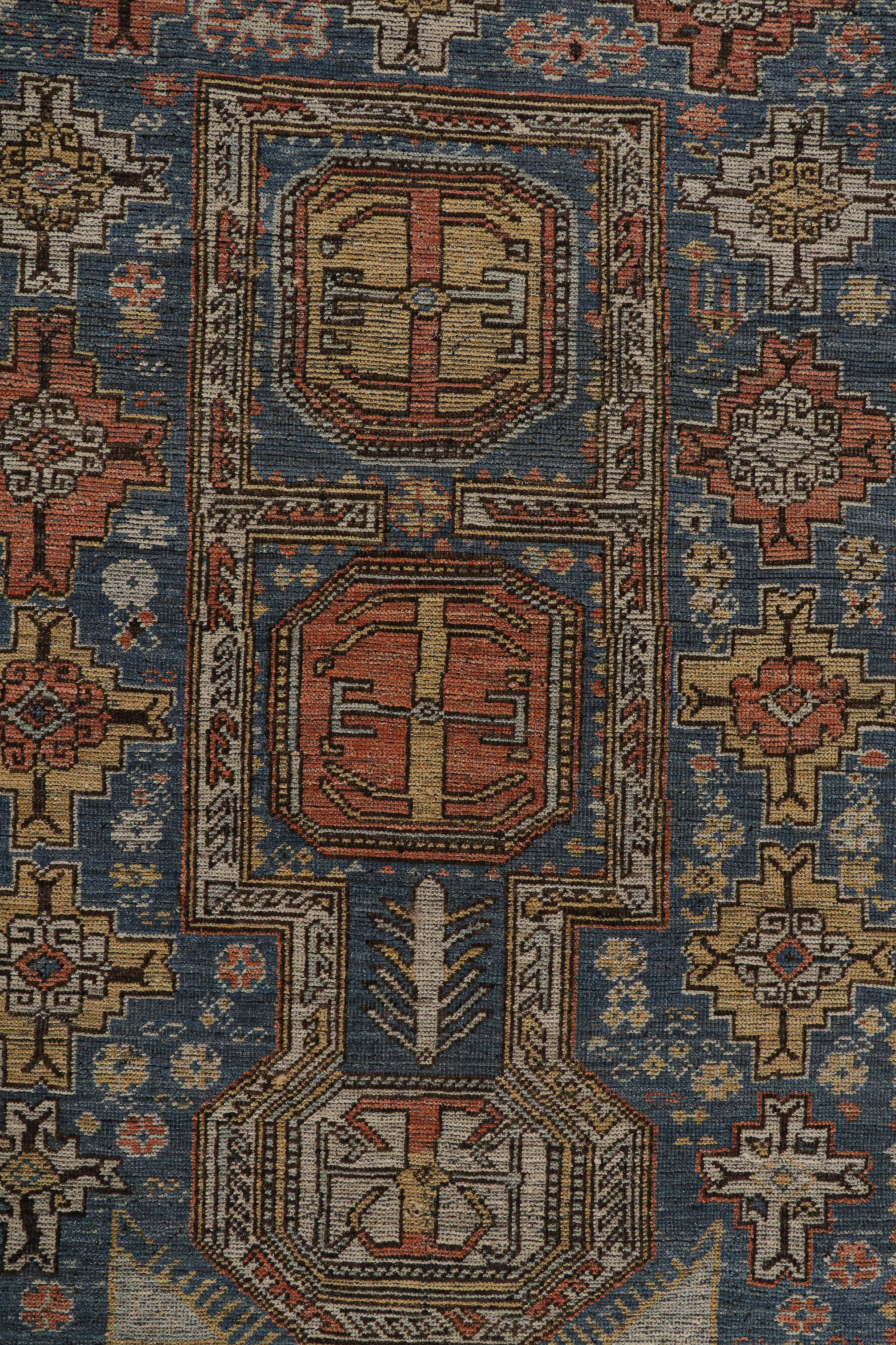 XXIe siècle et contemporain Rug & Kilim's Tribal Style Rug in Blue, with Red and Gold Geometric Patterns (tapis de style tribal en bleu, avec des motifs géométriques rouges et dorés) en vente