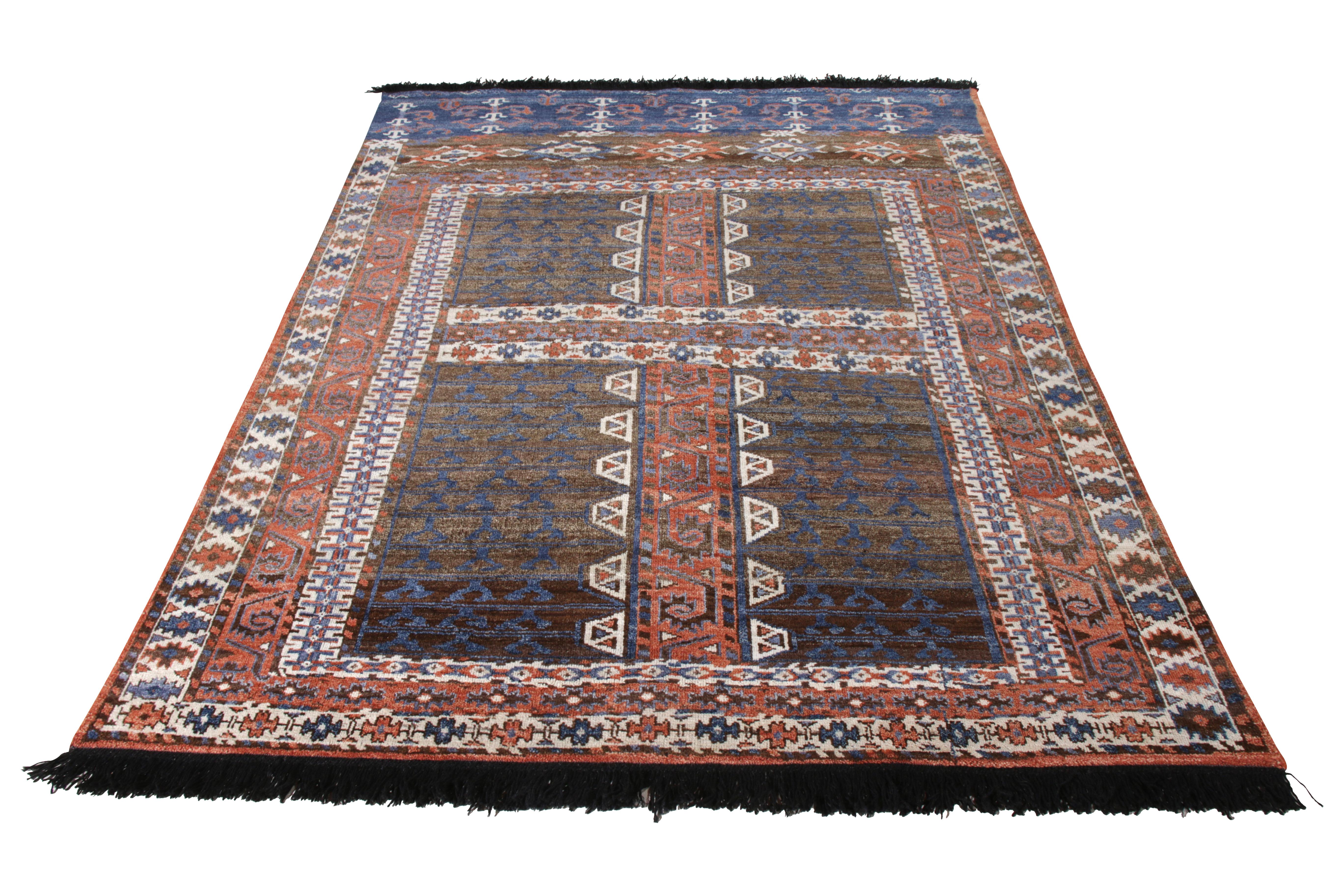 A 6x8 ode to celebrated tribal rug styles from Rug & Kilim’s Burano Collection. 
Hand knotted in wool, enjoying brown and red with white and blue in the all over geometric pattern. 
Drawing veritable inspiration from Persian Baluch rugs, likewise