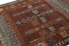 Rug & Kilim’s Tribal Style Rug in Rich Red, with Colorful Geometric Patterns