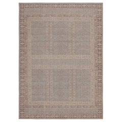 Rug & Kilim’s Tribal style rug with Mauve and Pastel Blue Geometric Patterns