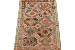 Rug & Kilim’s Tribal-Style Runner in Beige with Blue and Red Medallions